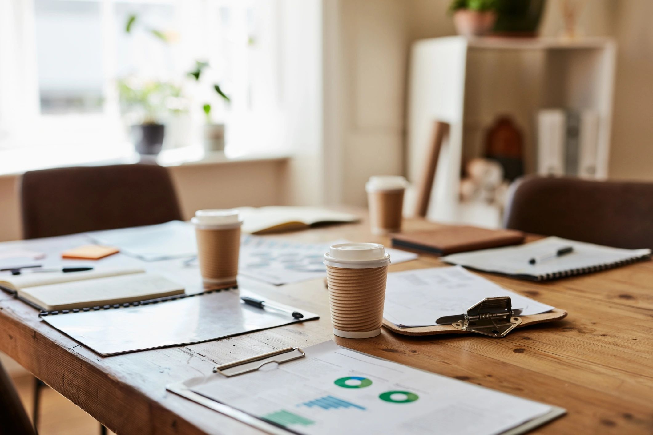 Prepared conference table with documents and planning materials