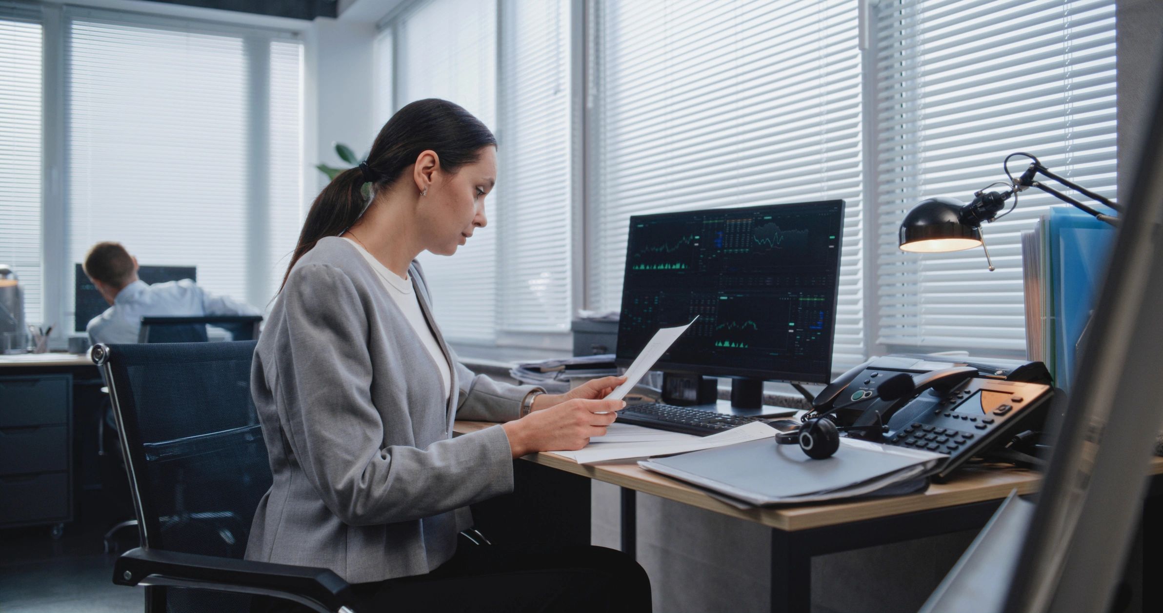 Professional reviewing legal documents at a desk